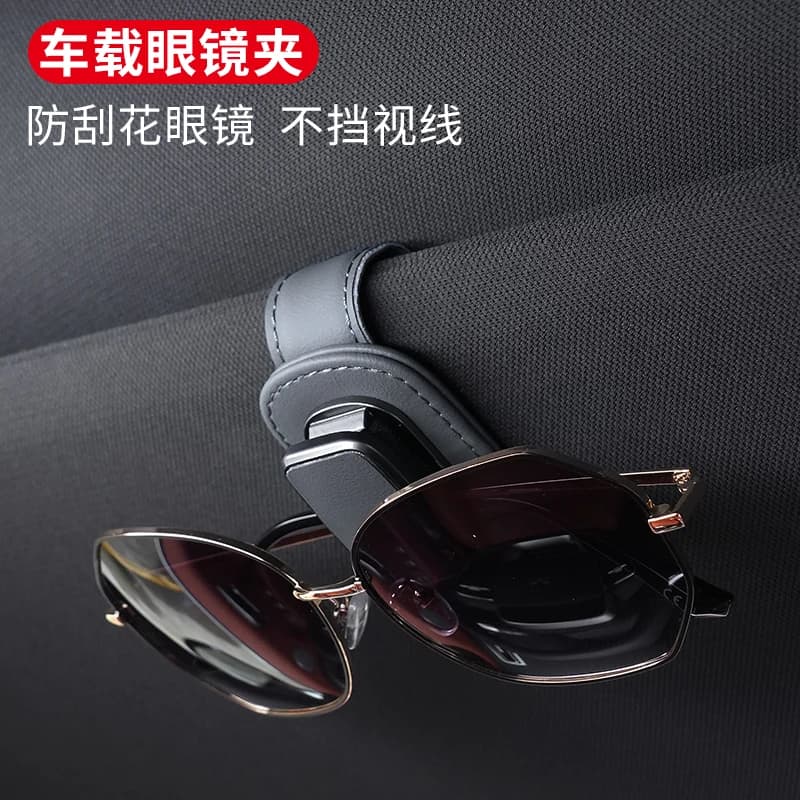 Compact car visor eyeglasses clip shown for product comparison